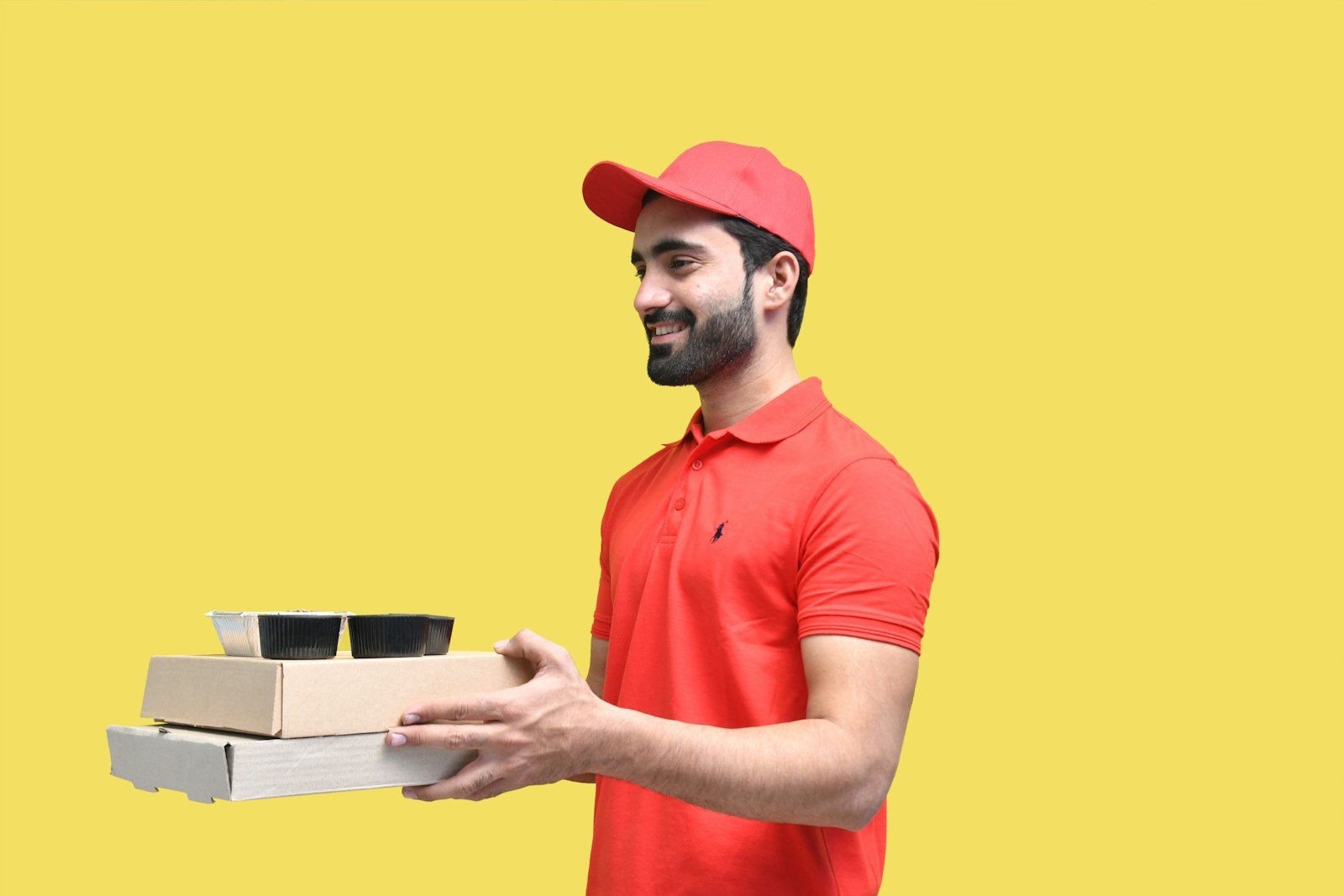 a man holding a stack of books